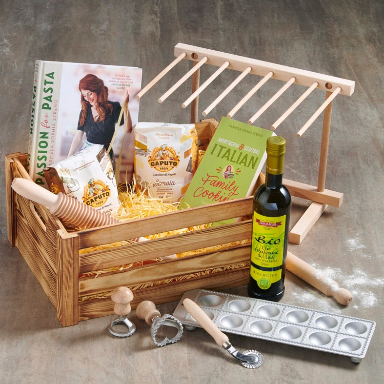 Pasta making hamper with cookery book, flour, olive oil and utensils.